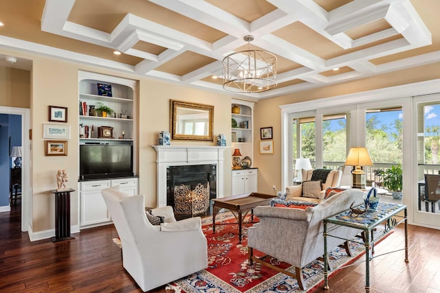 2636 Anchor Watch Dr, Wadmalaw Island, SC 29487 - living area with coffered ceiling, a notable chandelier, dark wood finished floors, built in features, and a high end fireplace