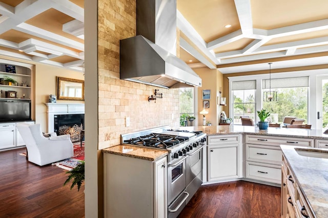 2636 Anchor Watch Dr, Wadmalaw Island, SC 29487 - kitchen featuring wall chimney range hood, light stone counters, range with two ovens, decorative backsplash, and coffered ceiling