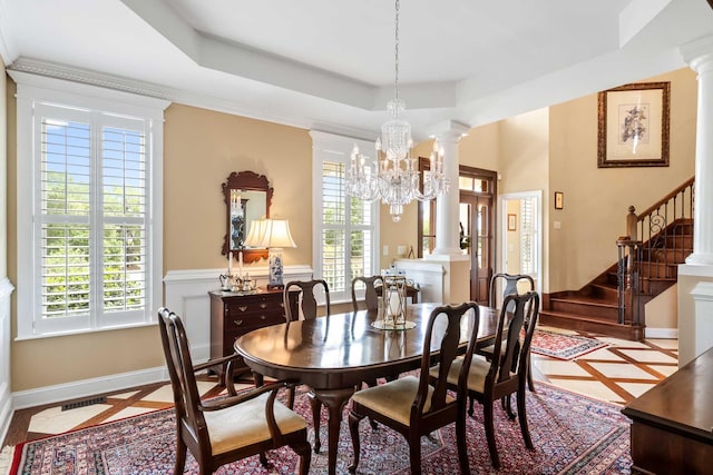 2636 Anchor Watch Dr, Wadmalaw Island, SC 29487 - dining area featuring a tray ceiling, stairs, plenty of natural light, and decorative columns