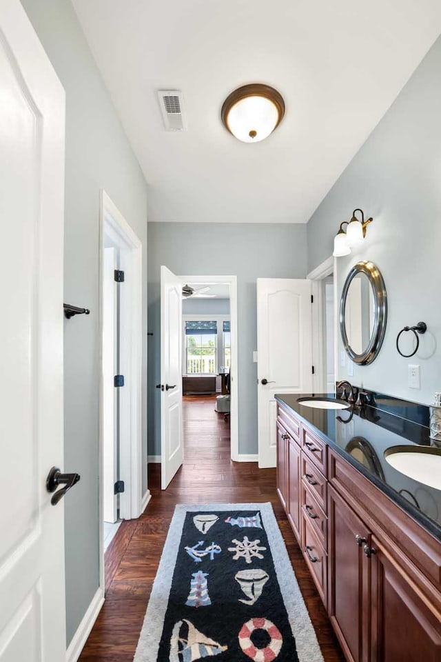 2636 Anchor Watch Dr, Wadmalaw Island, SC 29487 - bathroom with a sink, double vanity, visible vents, and wood finished floors