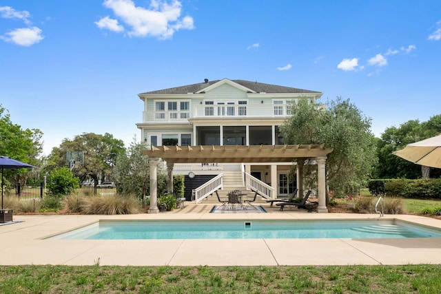 2636 Anchor Watch Dr, Wadmalaw Island, SC 29487 - back of property featuring stairs, a patio area, a sunroom, and an outdoor pool