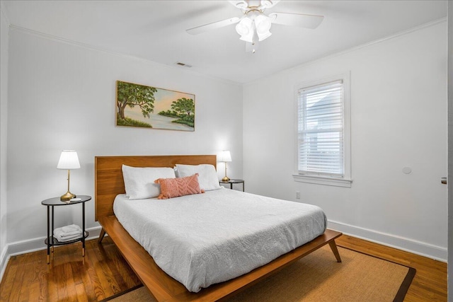 bedroom featuring hardwood / wood-style flooring and ceiling fan