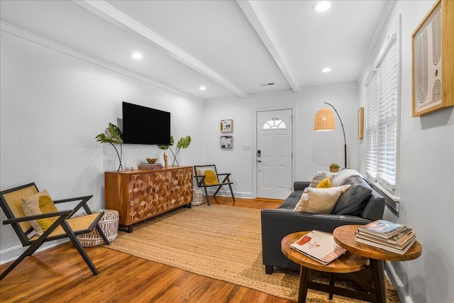 living room featuring beam ceiling and hardwood / wood-style flooring