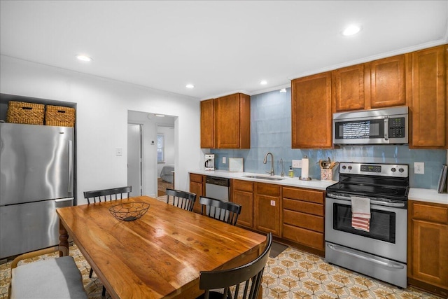 kitchen with backsplash, sink, light tile patterned floors, and stainless steel appliances