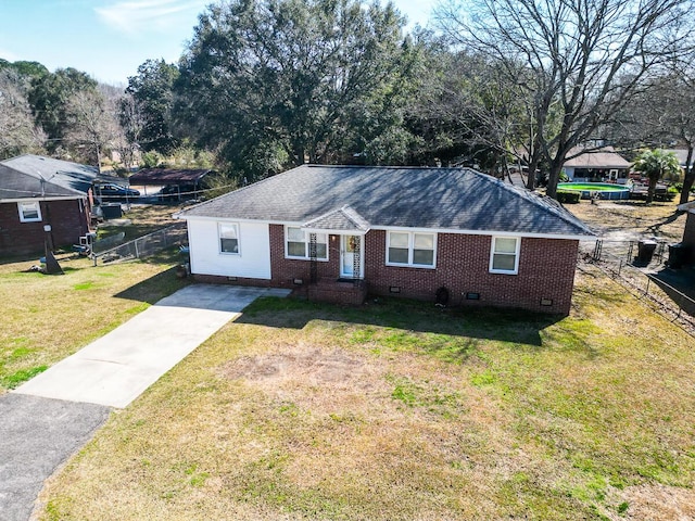 ranch-style home featuring roof with shingles, crawl space, fence, a front yard, and brick siding