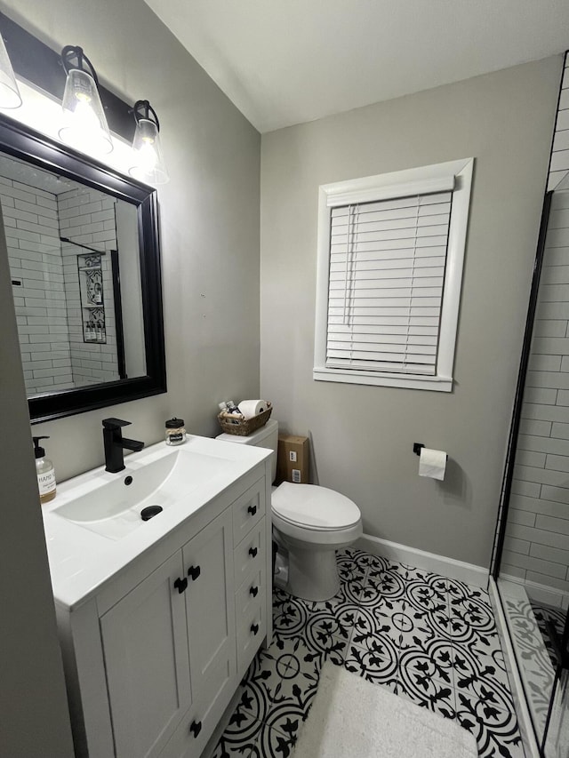 full bath with vanity, a shower stall, toilet, and tile patterned floors