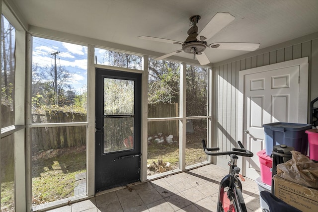 sunroom with a ceiling fan