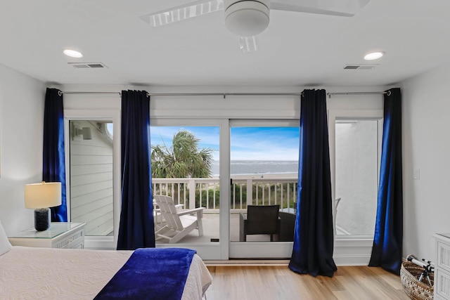 4 Beach Club Villas, Isle Of Palms, SC 29451 - bedroom with access to exterior, wood finished floors, a water view, recessed lighting, and ceiling fan