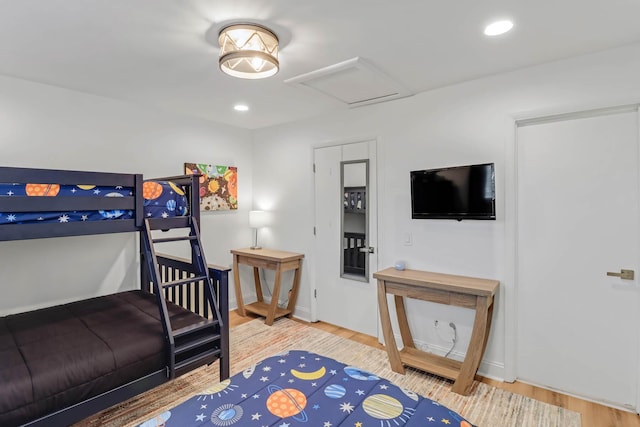 4 Beach Club Villas, Isle Of Palms, SC 29451 - bedroom with attic access, wood finished floors, and baseboards