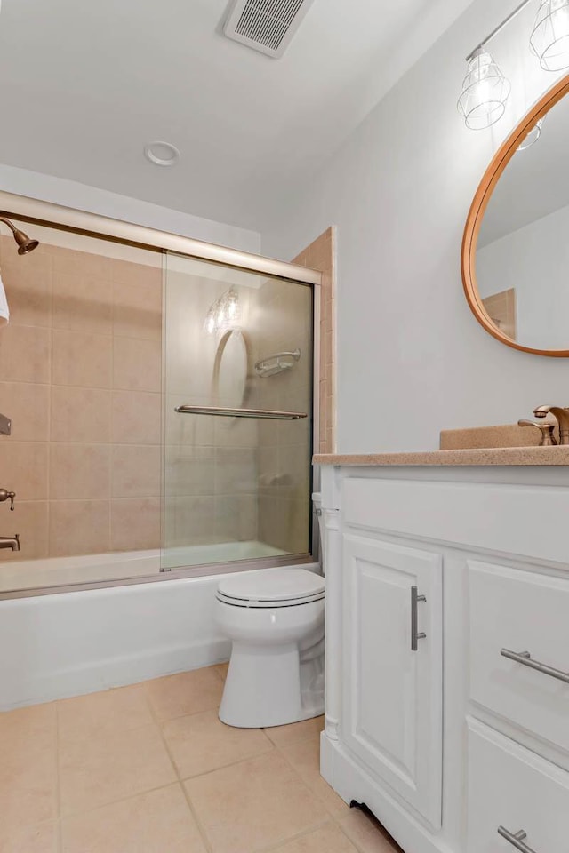 4 Beach Club Villas, Isle Of Palms, SC 29451 - full bathroom featuring vanity, tile patterned flooring, toilet, and bath / shower combo with glass door