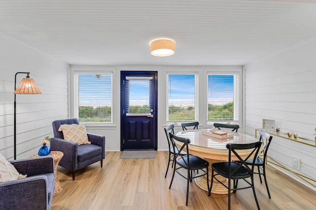4 Beach Club Villas, Isle Of Palms, SC 29451 - dining area featuring light wood finished floors and wooden walls