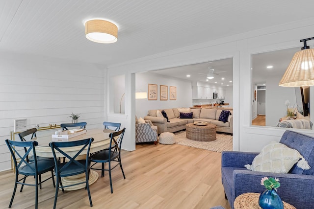 4 Beach Club Villas, Isle Of Palms, SC 29451 - living area featuring light wood-style flooring, ceiling fan, recessed lighting, and wood walls