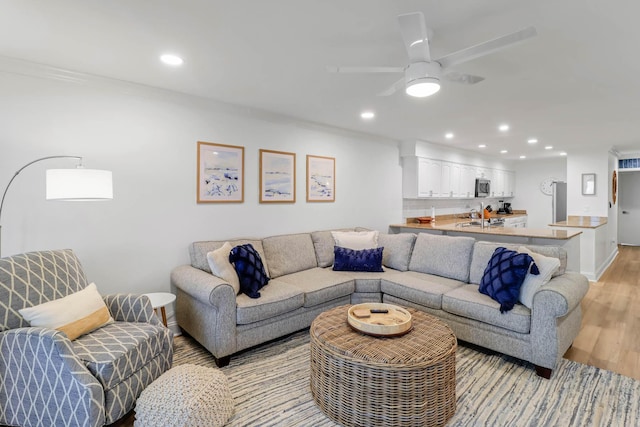 4 Beach Club Villas, Isle Of Palms, SC 29451 - living area with light wood-type flooring, recessed lighting, baseboards, a ceiling fan, and crown molding