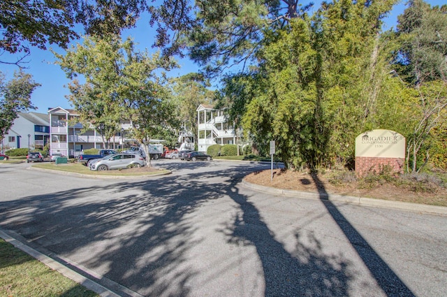 view of street featuring curbs and a residential view