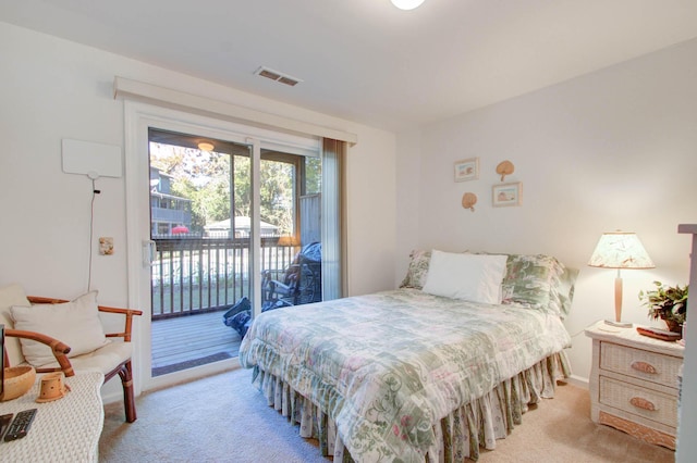 bedroom featuring light carpet, visible vents, and access to outside