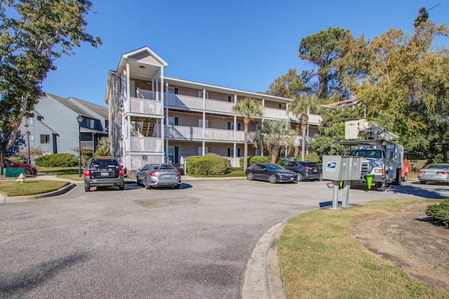 view of property with uncovered parking