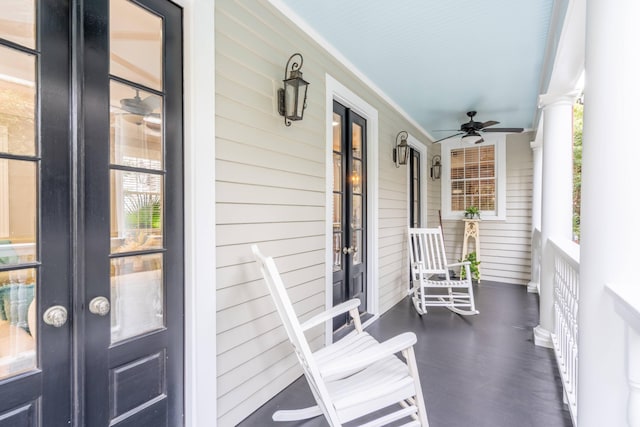 balcony featuring ceiling fan and a porch