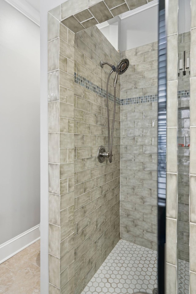 bathroom with a tile shower