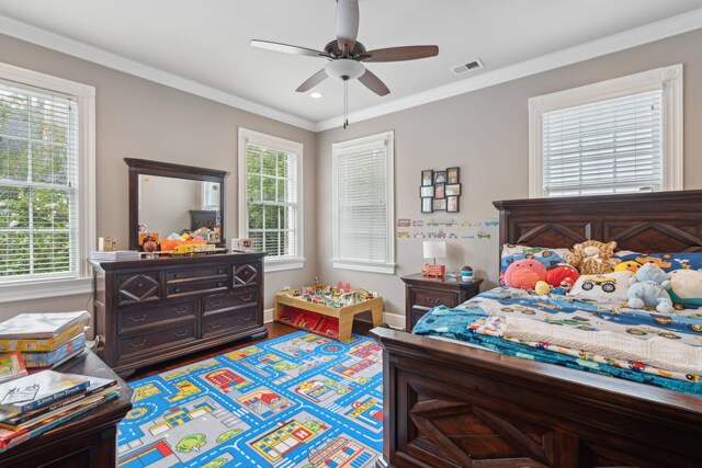 bedroom with ceiling fan, ornamental molding, and hardwood / wood-style floors