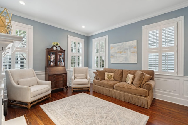 living room with crown molding, plenty of natural light, and dark hardwood / wood-style floors