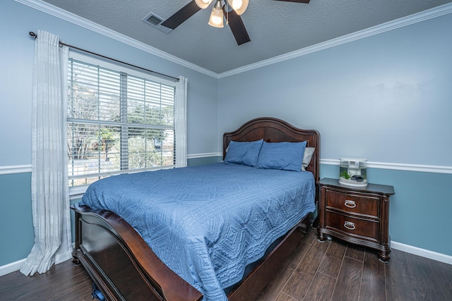 bedroom with visible vents, dark wood finished floors, and a textured ceiling