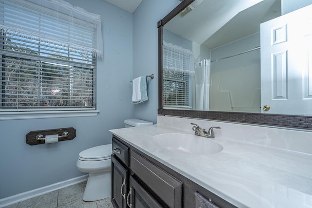 bathroom with baseboards, a shower with shower curtain, toilet, tile patterned floors, and vanity