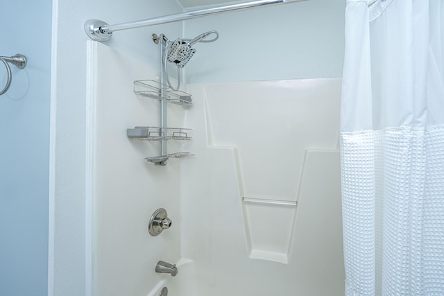 bathroom featuring shower / bath combo with shower curtain