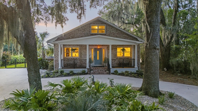 4940 Lambs Rd, North Charleston, SC 29418 - view of front of property with brick siding, covered porch, and driveway