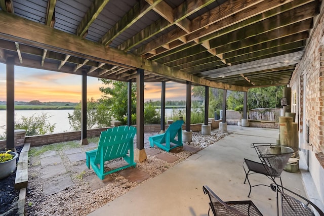 4940 Lambs Rd, North Charleston, SC 29418 - patio terrace at dusk with a water view and a patio