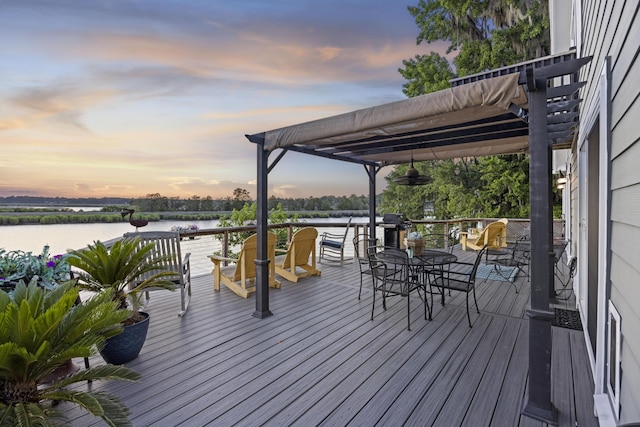 4940 Lambs Rd, North Charleston, SC 29418 - deck at dusk with a water view, grilling area, and outdoor dining space