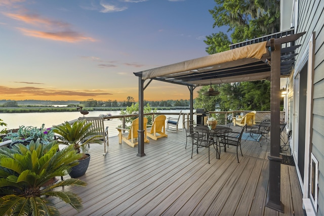 4940 Lambs Rd, North Charleston, SC 29418 - deck at dusk featuring a water view and outdoor dining area