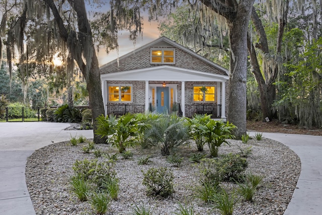 4940 Lambs Rd, North Charleston, SC 29418 - view of front of home featuring a porch and brick siding