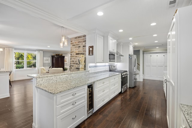 4940 Lambs Rd, North Charleston, SC 29418 - kitchen with appliances with stainless steel finishes, ornamental molding, a peninsula, white cabinetry, and dark wood-style floors