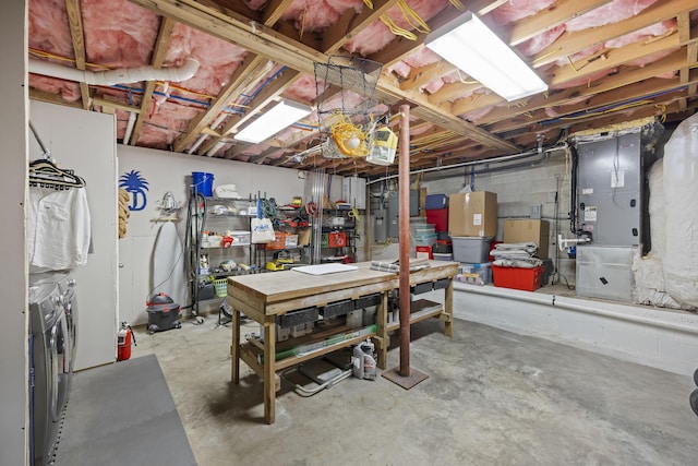 4940 Lambs Rd, North Charleston, SC 29418 - unfinished basement featuring a workshop area, heating unit, washing machine and clothes dryer, and electric panel