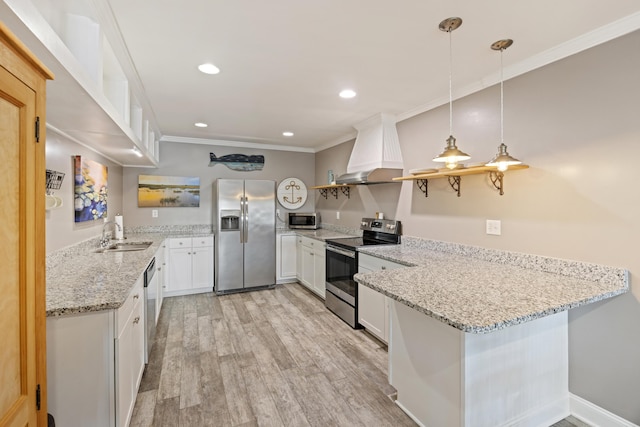 4940 Lambs Rd, North Charleston, SC 29418 - kitchen with appliances with stainless steel finishes, open shelves, premium range hood, white cabinetry, and light wood-type flooring
