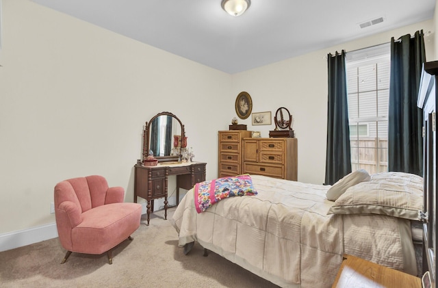 bedroom with light carpet