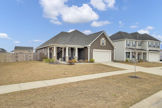 view of front facade featuring a garage and covered porch