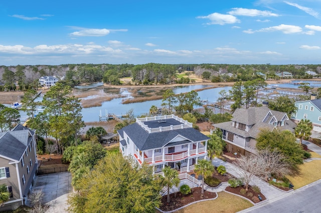 bird's eye view with a water view and a residential view