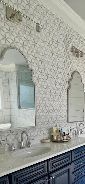 bar with a sink, decorative backsplash, and crown molding