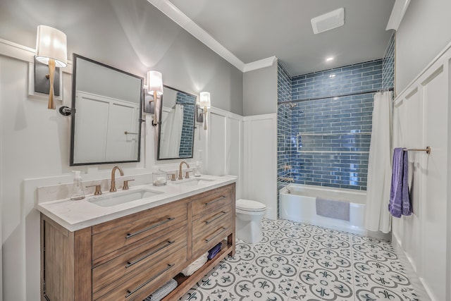 full bathroom with shower / bath combination with curtain, ornamental molding, a sink, and toilet