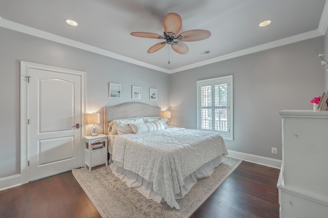 bedroom featuring dark wood-style floors, baseboards, visible vents, and crown molding