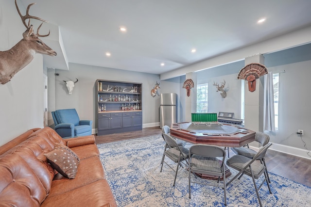 recreation room with recessed lighting, baseboards, and wood finished floors