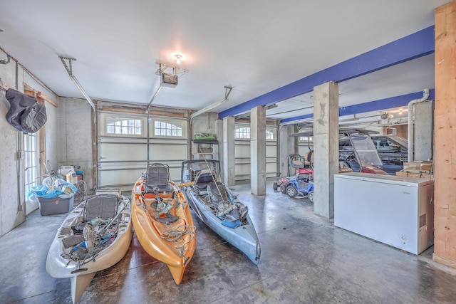 garage with fridge and a garage door opener