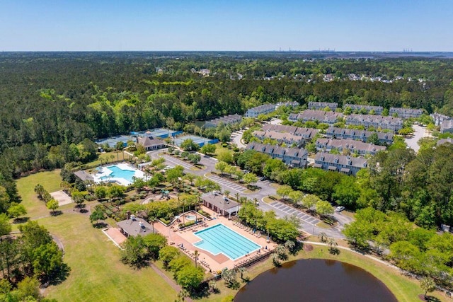 birds eye view of property with a forest view