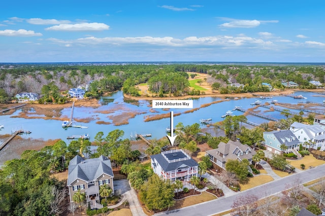 birds eye view of property featuring a water view and a residential view