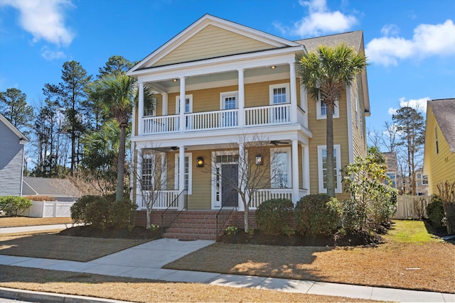 view of front of home with covered porch and fence