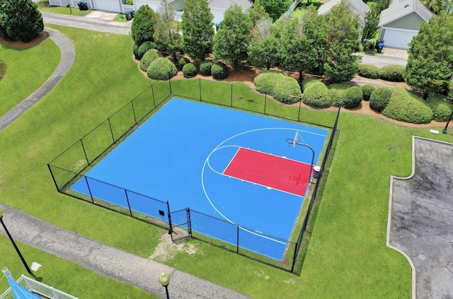 view of sport court featuring community basketball court, a yard, and fence