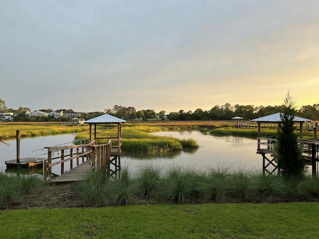 view of dock featuring a water view and a gazebo