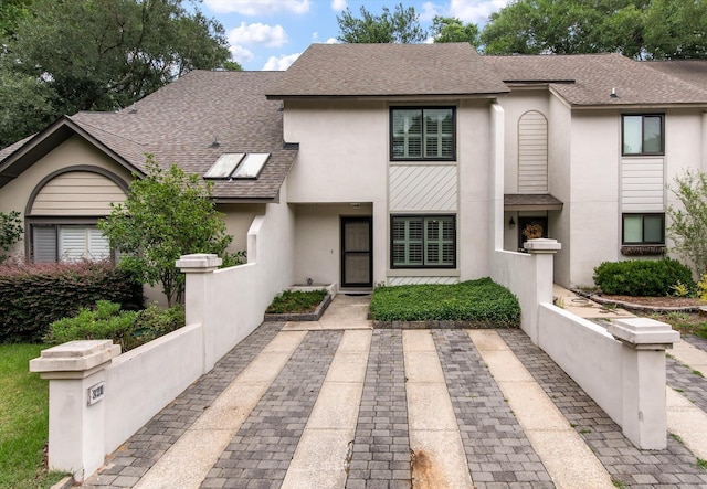321 Lapwing Ln, Mount Pleasant, SC 29464 - view of property with stucco siding and roof with shingles