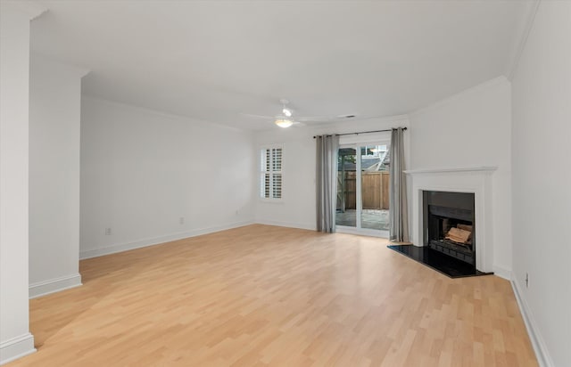 321 Lapwing Ln, Mount Pleasant, SC 29464 - unfurnished living room with ornamental molding, light wood-style floors, ceiling fan, a fireplace with raised hearth, and baseboards